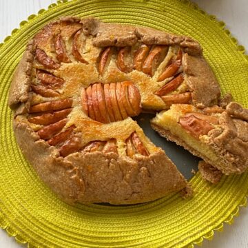 Apple and Frangipane Tart with a slice cut out.