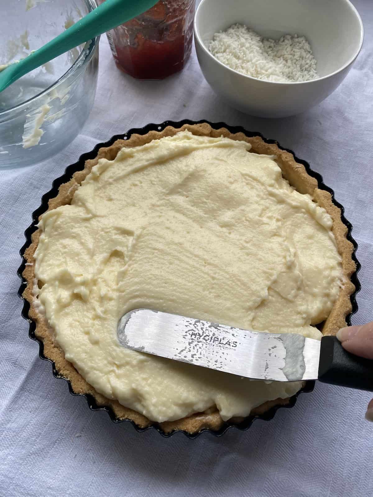Manchester tart covered with a custard layer.