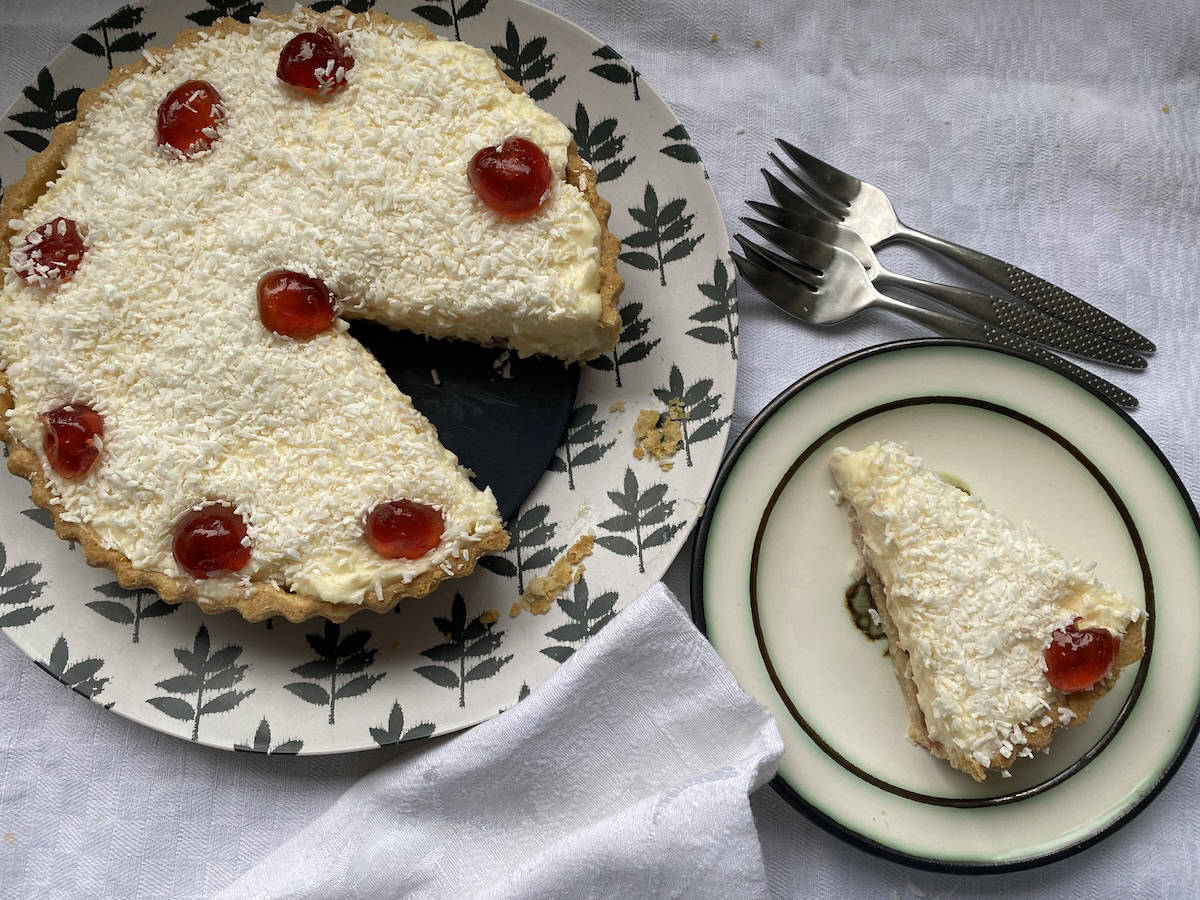 Manchester Tart with a slice cut out.