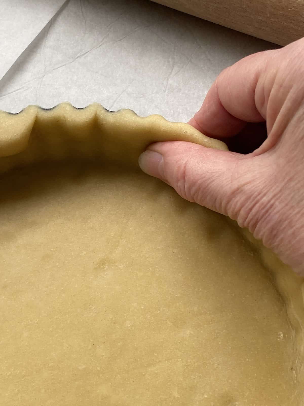 Neaten the pastry edges.