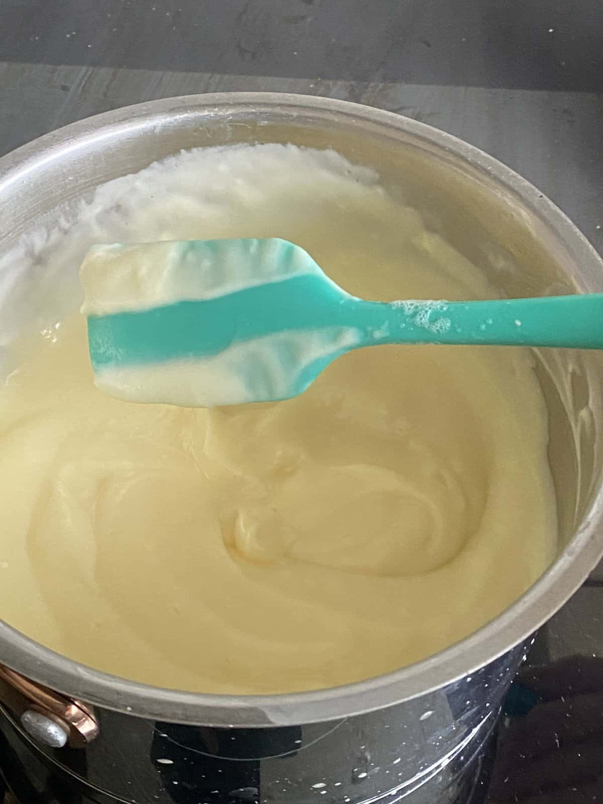 Thick custard in a pan.