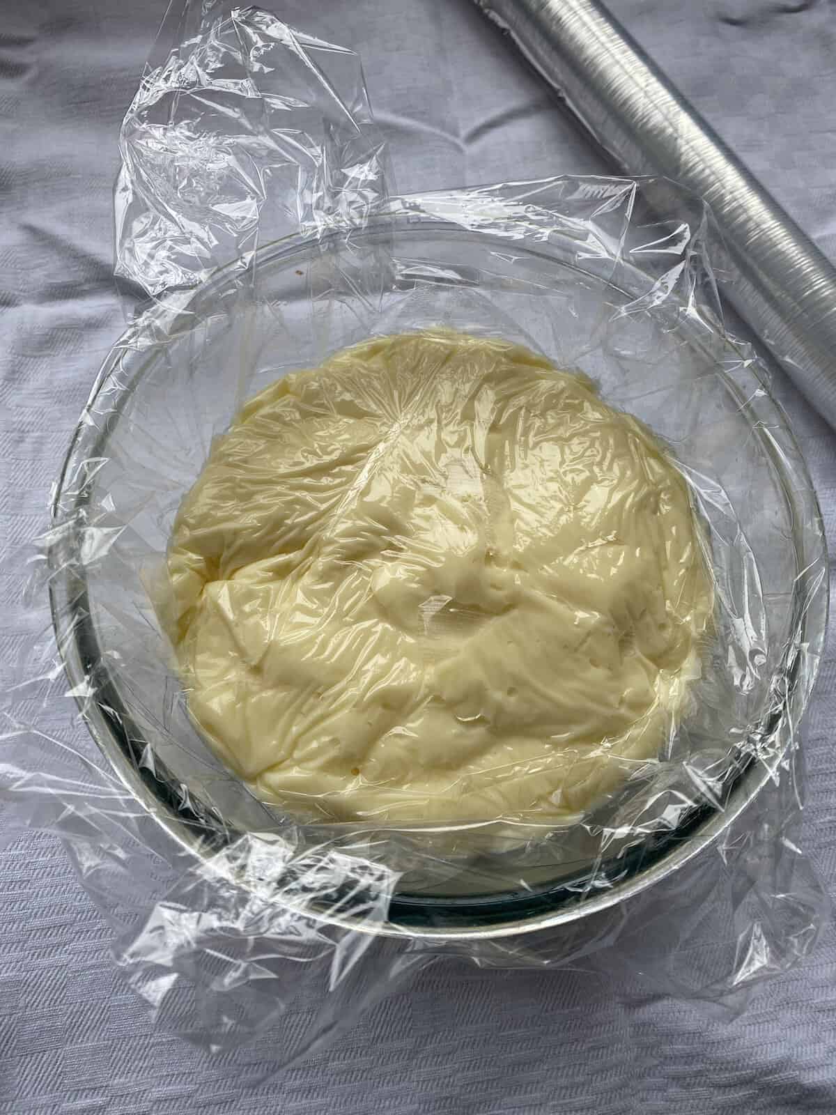 Thick Custard in a dish covered in cling film.