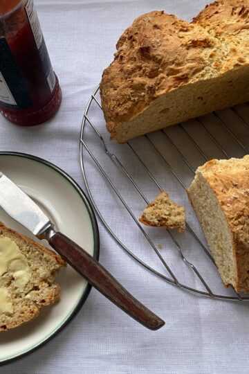Fresh baked buttermilk soda bread, buttered and with strawberry jam.