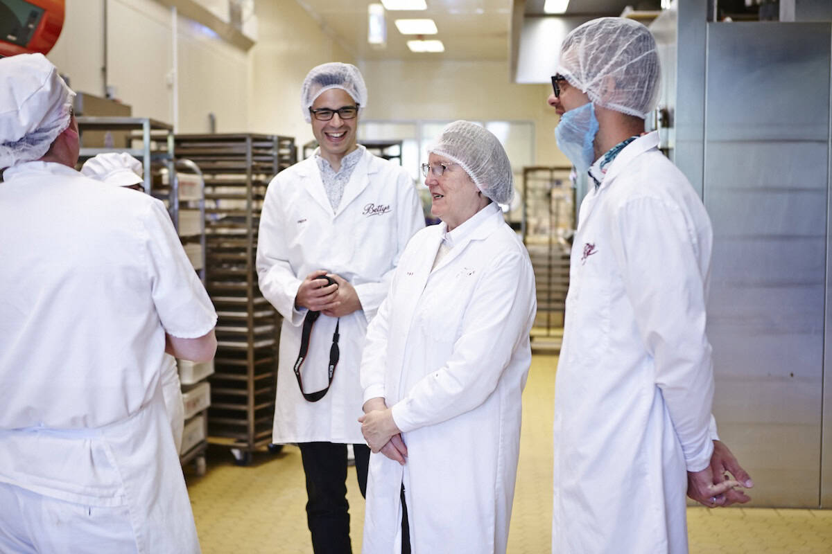Group of people wearing white coats in Bettys bakery.
