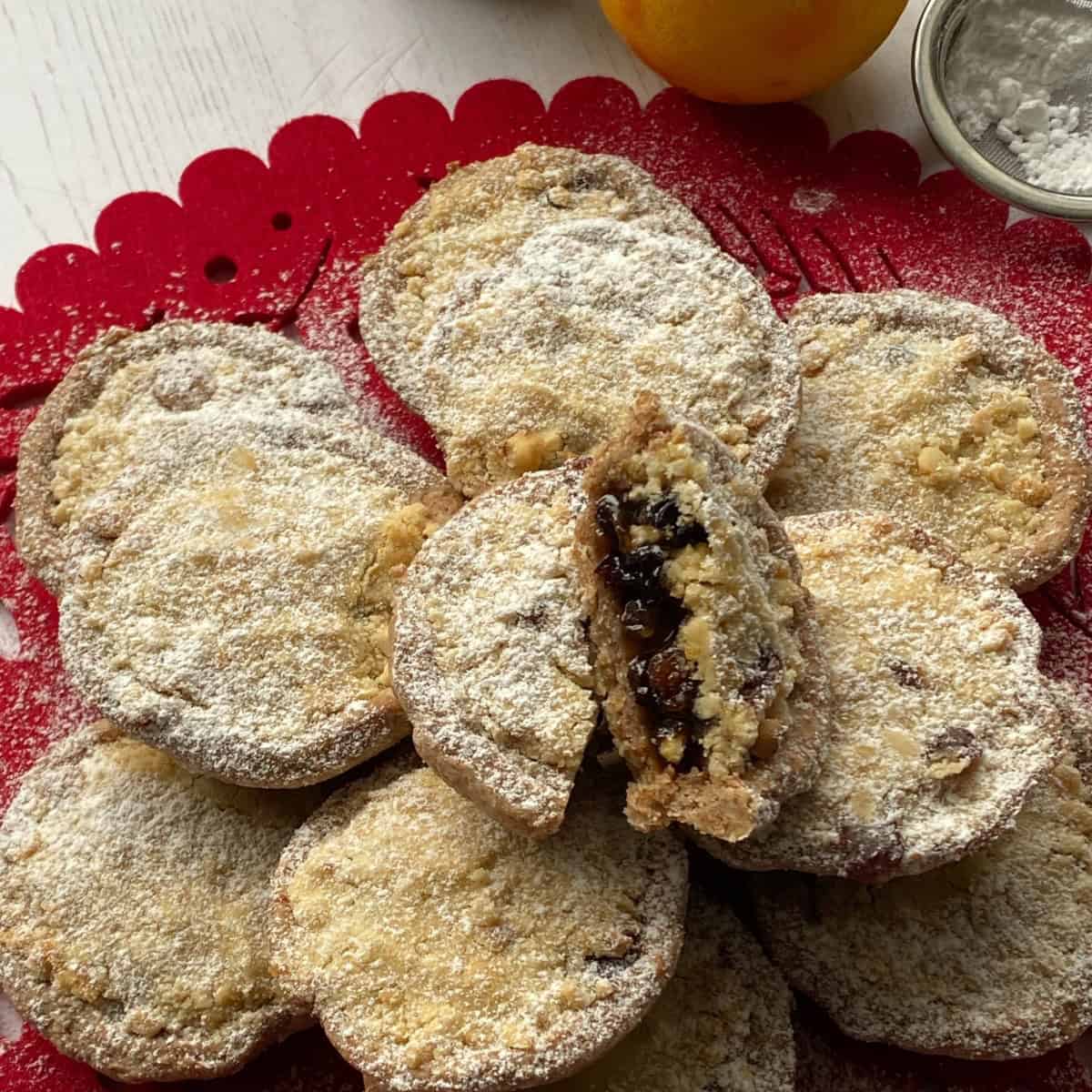 Mincemeat Streusel Pies on a red place mat. Small Streusel Mince Pies on a red place mat.
